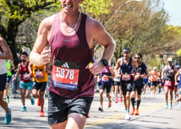 Close-up of a runner showing proper running form and cadence while going uphill.
